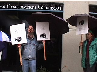 [Pic: EFF's Will Doherty & Henry Schwan with picket signs]